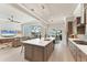 Well-appointed kitchen featuring an island, modern appliances, and seamless flow to the living and outdoor areas at 16436 Daysailor Trl, Lakewood Ranch, FL 34202