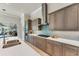 Chef's kitchen featuring modern appliances, custom cabinetry, and sleek countertops for a luxurious cooking experience at 16436 Daysailor Trl, Lakewood Ranch, FL 34202
