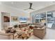 Spacious living room with water views, comfortable seating, and modern decor at 16436 Daysailor Trl, Lakewood Ranch, FL 34202