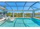 Beautiful screened-in pool area with waterfront views and lounge chairs at 16436 Daysailor Trl, Lakewood Ranch, FL 34202