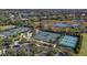 Aerial view of tennis and pickleball courts in a community with a view of the surrounding area at 16436 Daysailor Trl, Lakewood Ranch, FL 34202