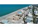 This aerial view features a charming beach house surrounded by homes, and close to the shoreline at 1107 Shore View Dr, Englewood, FL 34223
