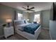 Comfortable bedroom featuring a decorative nautical themed bed, and an adjacent desk area at 1107 Shore View Dr, Englewood, FL 34223