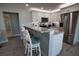 Contemporary kitchen with stainless steel appliances, breakfast bar, and modern finishes, perfect for cooking at 1107 Shore View Dr, Englewood, FL 34223