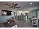 Inviting living space with a spacious kitchen island, stainless steel appliances, and seamless flow for entertaining at 1107 Shore View Dr, Englewood, FL 34223