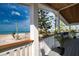 Charming outdoor porch with a wood plank ceiling and gorgeous ocean views at 1107 Shore View Dr, Englewood, FL 34223