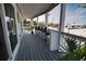 Covered porch features an outdoor bar with seating, offering a relaxing space to enjoy the coastal atmosphere at 1107 Shore View Dr, Englewood, FL 34223