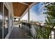 Charming outdoor porch with a wood plank ceiling and gorgeous ocean views at 1107 Shore View Dr, Englewood, FL 34223