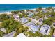 Aerial view showing proximity to beach, with turquoise waters, near lush, tropical landscaped neighborhood at 113 Palm Ave, Anna Maria, FL 34216