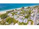 Beautiful aerial view of neighborhood near the beach with vibrant blue water at 113 Palm Ave, Anna Maria, FL 34216