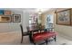 Dining area with tile flooring, a dark wood table, decor, and access to other rooms of the house at 113 Palm Ave, Anna Maria, FL 34216