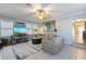 Cozy living room with tile flooring, comfortable seating, and plenty of natural light at 113 Palm Ave, Anna Maria, FL 34216