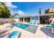 Stunning backyard pool with a spa and ample lounge area, great for entertaining or unwinding at 113 Palm Ave, Anna Maria, FL 34216