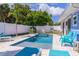 Inviting backyard pool and spa surrounded by lush greenery, ideal for outdoor enjoyment at 113 Palm Ave, Anna Maria, FL 34216