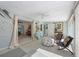 Sun room featuring decor, ceiling fan, tile floor, and access to other rooms of the house at 113 Palm Ave, Anna Maria, FL 34216