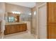 Well-lit bathroom boasting a double vanity and walk-in shower at 11723 Cullen Park Ter, Bradenton, FL 34211