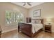 Bedroom with hardwood floors and a large window at 11723 Cullen Park Ter, Bradenton, FL 34211
