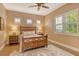 Comfortable bedroom with wood floors, plantation shutters, and bedside lamps at 11723 Cullen Park Ter, Bradenton, FL 34211