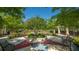 Community picnic area featuring a center tree, colorful design, benches, and tables at 11723 Cullen Park Ter, Bradenton, FL 34211