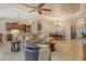 Spacious open-concept living room with adjacent kitchen and dining area, perfect for entertaining guests at 11723 Cullen Park Ter, Bradenton, FL 34211