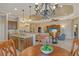 Spacious open-concept living area with kitchen island and hardwood floors at 11723 Cullen Park Ter, Bradenton, FL 34211