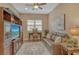Comfortable home office with large entertainment center and natural light at 11723 Cullen Park Ter, Bradenton, FL 34211