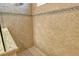 Tiled shower with glass and mosaic design at 11723 Cullen Park Ter, Bradenton, FL 34211