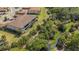 Scenic aerial view of the condos, showcasing lush green landscaping and stream at 12405 Osorio Ct # 202, Sarasota, FL 34238