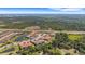 A beautiful aerial view of a neighborhood featuring a tranquil pond, lush foliage and homes at 12405 Osorio Ct # 202, Sarasota, FL 34238