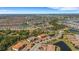 Expansive aerial view showcasing a community with multiple ponds and lush landscapes under a clear blue sky at 12405 Osorio Ct # 202, Sarasota, FL 34238
