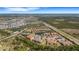 Gorgeous aerial view showcases a community with multiple ponds and lush landscapes under a clear blue sky at 12405 Osorio Ct # 202, Sarasota, FL 34238