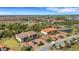 Aerial perspective of residential condos amidst meticulously manicured grounds and convenient parking at 12405 Osorio Ct # 202, Sarasota, FL 34238