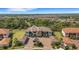 Bird's-eye view of a residential complex offering lush green surroundings and a serene community atmosphere at 12405 Osorio Ct # 202, Sarasota, FL 34238