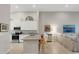 Modern kitchen with granite counters, stainless steel appliances, and eat-in breakfast bar at 12405 Osorio Ct # 202, Sarasota, FL 34238