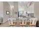 Kitchen with granite countertops, stainless appliances, white cabinets, and barstool seating at 12405 Osorio Ct # 202, Sarasota, FL 34238