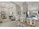 Contemporary kitchen with granite countertops and barstool seating overlooking the living area at 12405 Osorio Ct # 202, Sarasota, FL 34238