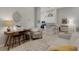 Open living space with views of the kitchen, features neutral colors and tiled floors at 12405 Osorio Ct # 202, Sarasota, FL 34238