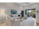 Bright living room with sliding glass doors to the balcony provides natural light and views at 12405 Osorio Ct # 202, Sarasota, FL 34238