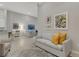 This spacious living room features stylish decor and ample natural light at 12405 Osorio Ct # 202, Sarasota, FL 34238