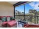 Serene screened patio with cozy seating overlooking tropical foliage and clear blue skies at 12405 Osorio Ct # 202, Sarasota, FL 34238