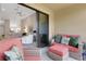 Screened-in patio with comfortable seating, seamless indoor-outdoor flow to a sunny living room at 12405 Osorio Ct # 202, Sarasota, FL 34238