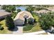 Beautiful home features a backyard, lawn, pond and lake views, and mature trees at 14404 Stirling Dr, Lakewood Ranch, FL 34202