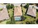 Aerial view of a beautiful home featuring a screened pool in a well-maintained yard at 14404 Stirling Dr, Lakewood Ranch, FL 34202
