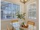 Bright dining area with glass table and a gorgeous view of the exterior and pool at 14404 Stirling Dr, Lakewood Ranch, FL 34202
