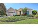 Charming one-story home features a well-manicured lawn, two-car garage, and lovely landscaping at 14404 Stirling Dr, Lakewood Ranch, FL 34202