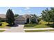 Charming single-story home with a paver driveway, two-car garage, and well-maintained landscaping at 14404 Stirling Dr, Lakewood Ranch, FL 34202