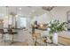 Open kitchen features bar seating, stainless appliances, and bright white cabinets at 14404 Stirling Dr, Lakewood Ranch, FL 34202