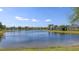 Expansive lake view showcasing waterfront living with lush landscaping and scenic beauty at 14404 Stirling Dr, Lakewood Ranch, FL 34202