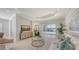 Bright living room with stylish decor, comfortable seating, and a seamless transition to outdoor pool area at 14404 Stirling Dr, Lakewood Ranch, FL 34202
