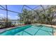 A screened-in pool with spa and beautiful lake view is perfect for relaxation at 14404 Stirling Dr, Lakewood Ranch, FL 34202